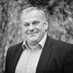 A staff image depicting Charles White, CEO of The Cyber Scheme